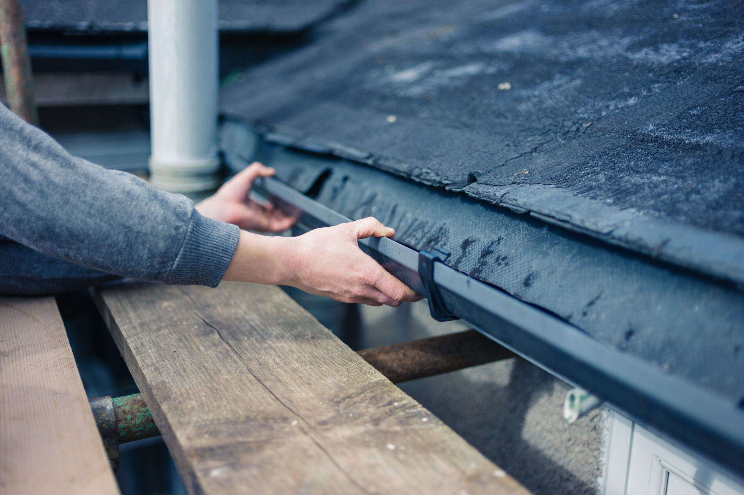 Man working with gutters